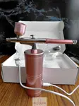 Cordless airbrush for decorating sugar cookies with royal icing