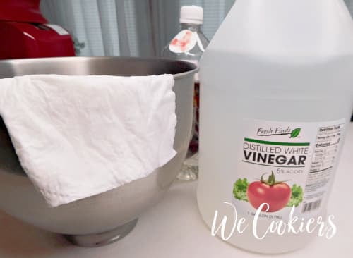 Photo showing to wipe out the mixing bowl with vinegar before you start making the royal icing Step 1. Wipe out bowl with vinegar