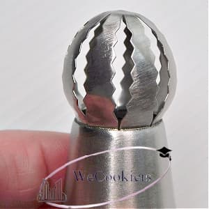 The image shows a Russian ball piping tip for buttercream flowers.