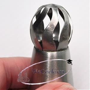 The image shows a Russian ball piping tip for buttercream flowers.