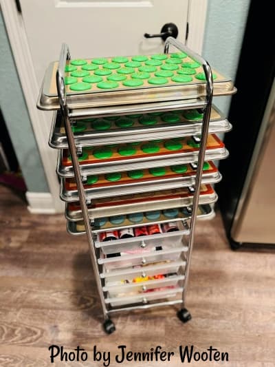 This is an image of a storage cart with the drawers taken out. 1/2 sheet baking pans slide through the side for a makeshift baker's rack.