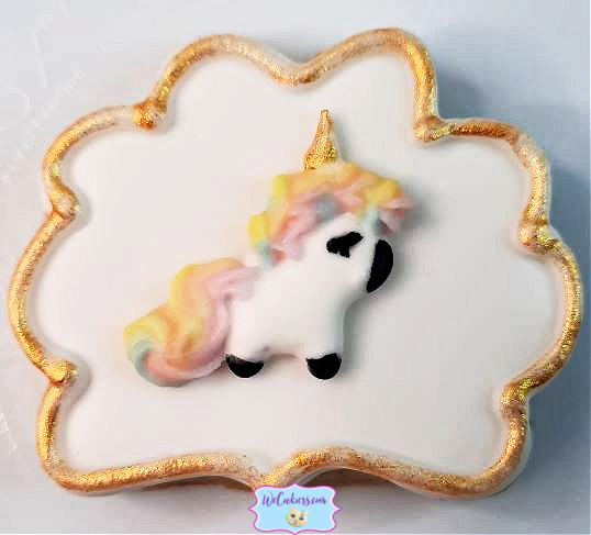 This little cutie is a royal icing transfer of a unicorn placed on a sugar cookie. Decorating cookies at their easiest! Place a drop of royal icing on the back and adhere to the cookie. Royal icing unicorn transfer