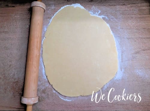 Dough rolled out to prepare for cutting out cookies