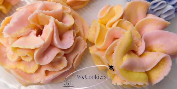 This image is of buttercream flowers, piped with the same tip, in two different ways.
