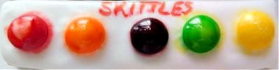 Skittles are an easy way to make a cookie palette. There are some cons though. Check out the 10 comparison video of various methods! Image of using skittles for a palette