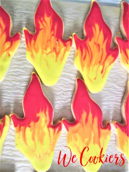 The sugar cookie flames were made using a wet-on-wet technique. Wet-on-wet technique making flames, image