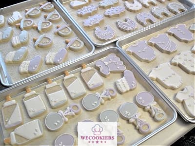 Even decorated conservatively, you can make baby cookies that they will swoon over. See more ideas, techniques, and royal icing templates here: Decorated baby shower cookies for boys or girls. These cookies are decorated with gray, lavender, and white. Soft and sweet!