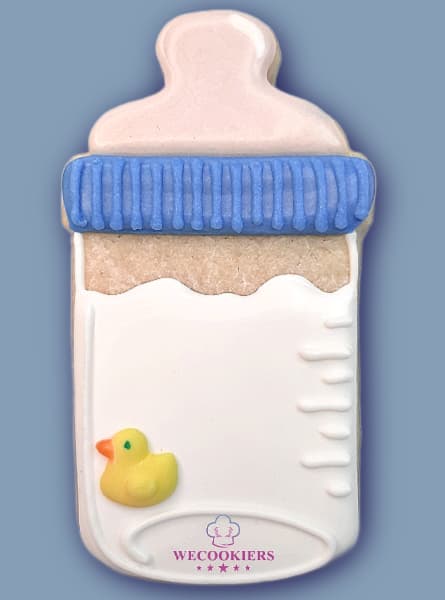 Always a staple in shower cookies, this baby boy bottle is enhanced with a sweet rubber ducker royal icing transfer. Get the templates here: Baby boy bottle cookie cutter with a rubber duckie royal icing transfer.