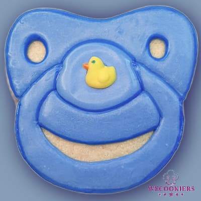 This cute pacifier sugar cookie is the perfect complement to any set of baby shower cookies...and oh-so-easy to decorate! The RI template is in Shop Gotta-havs! See more: Blue pacifier with rubber duckie royal icing transfer from Shop Gotta-havs! royal icing templates