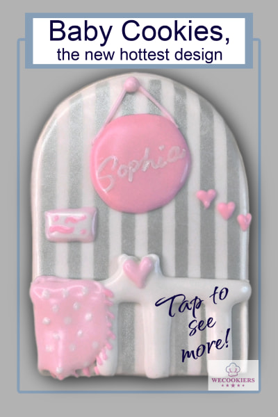 A darling photo of a crib scene against a striped wall. I piped a round name plaque on the 'wall' behind the crib and added a little picture and hearts.