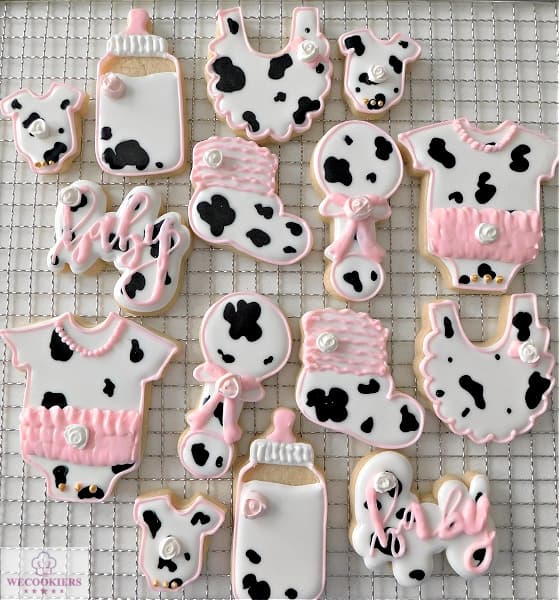 These darling cowprint baby girl shower cookies by WeCookiers went viral on Pinterest! Though super simple, they are real show-stoppers! It's a wet-on-wet technique.