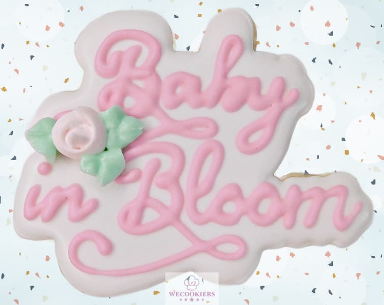 This lovely little cutter is so sweet for boy or girl baby cookies. See the video of the complete set, for more ideas, techniques, etc. This is a cookie that says 'Baby in bloom'. This is for a baby girl shower with pink and white royal icing with florals.