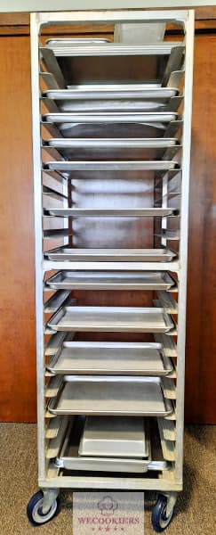 I use a 20-shelf baker's rack that holds 50 pans to cool my sugar cookies on after baking and to provide extra room after decorating. See more tips: This is a large, 20-shelf baker's rack that holds 40 1/2 sheet pans.