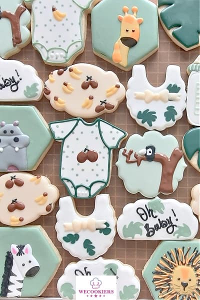 Jungle-themed cookies for a boy's baby shower. The coconuts and bananas are royal icing transfers. The templates can be found in Shop Gotta-havs! Jungle theme set for baby boy shower cookies. I piped the animals instead of using shapes. Royal icing transfers were used for the coconuts and bananas.