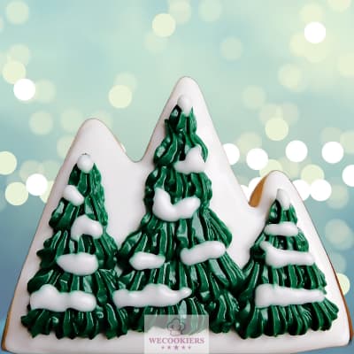 Christmas cookie decorating ideas for Christmas trees: a cookie flip, mountains into trees with snow