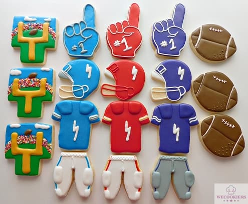 Football-themed cookies showing the helmet, jersey, pants, and foam finger in different team colors.