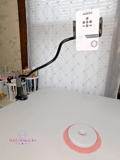 This is a gooseneck mount to hold a cookie projector. It clamps to your table or desk to free up workspace. Gooseneck Mount with Pico