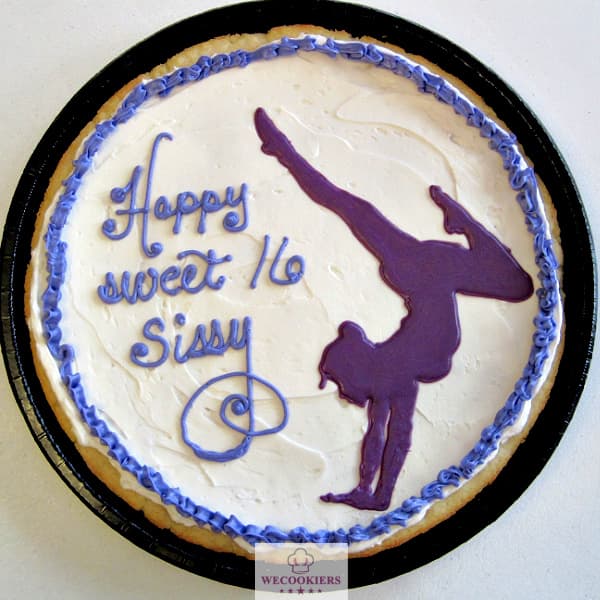 This pizookie features buttercream frosting with a large royal icing transfer of a gymnast. See more sports sugar cookies ideas:https://www.wecookiers.com/sports-sugar-cookies.html Pizookie sports sugar cookie