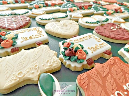 Cookie stenciling techniques using the scraping method for fall wedding cookies.