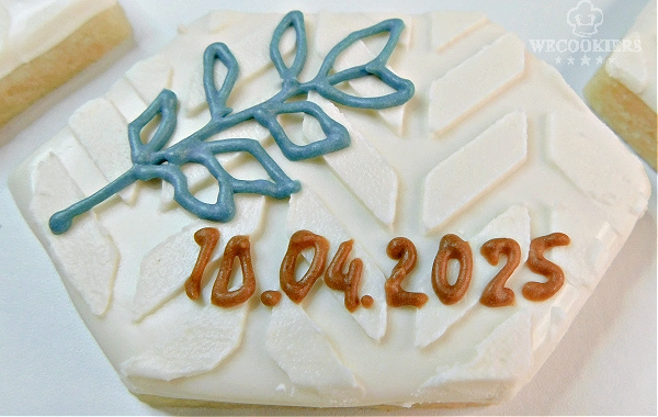 Bridesmaid date cookie using the scraping method for decorating cookies.